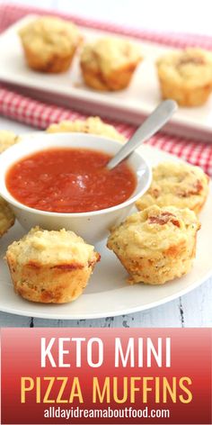 keto mini pizza muffins on a white plate with a bowl of marinara sauce