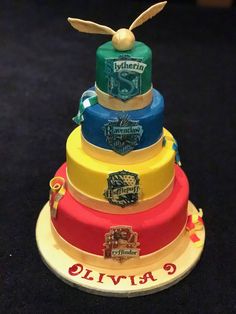 a multi - tiered cake with harry potter on top