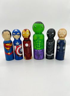 a group of wooden toy figurines sitting next to each other