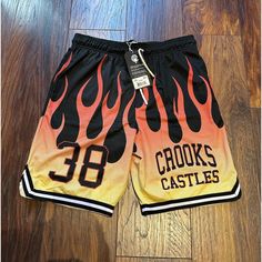 Brand New W/ Tags!!!! Size: Medium Color: Black/Red/Orange/Yellow These Shorts Feature A Front Graphic Print, Front Slash Pockets, An Elastic Waistband, A Drawstring Closure, An Inner Liner, And An 8-In Inseam. They Are Made From 100% Polyester. #Crooksandcastle #Crooksandcastles #Crooks #Streetwear #Crooksncastles #Fashion #Crooksandcastlesclothing #Crooksambassador #Castles #S #Hype #Vintage #Hiphop #Jualcrooksandcastles #Cantstopthecrooks #Skateboard #Crooksncastle #Crooksandcastlestshirt #Cr Vintage Hiphop, Black Castle, Crooks And Castles, Fire Flame, Streetwear Shorts, Red Orange Yellow, New Era Cap, Basketball Shorts, Shorts Athletic