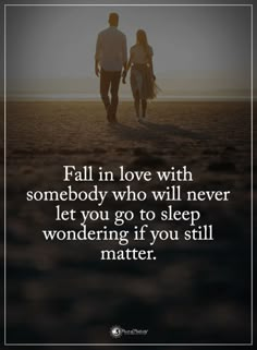 two people walking together with the words fall in love with somebody who will never let you go to sleep wondering if you still matter