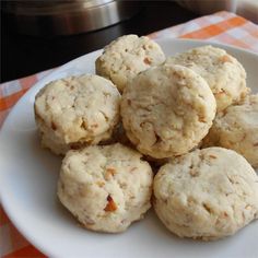 a white plate topped with cookies on top of a table