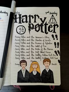 an open harry potter notebook with hand drawn characters on it and a pen next to it