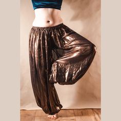 Copper harem pants for tribal fusion / FCBDS  Harem pants made from chiffon fabric :) Length: 99cm Width: 34cm The elastic band stretches up to: 50cm Model on the photo is 168cm tall. Colour: Copper Hand wash at 30 degrees Celsius. Made in Poland. Traditional Ankle-length Harem Pants For Festivals, Bohemian Full-length Relaxed Fit Harem Pants, Hippie Full-length Harem Pants For Festivals, Red Bohemian Wide-leg Harem Pants, Fitted Bohemian Full-length Harem Pants, Band Stretches, Fusion Dance, Womens Trousers, Womens Pants