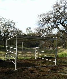 a white fence in the middle of a field