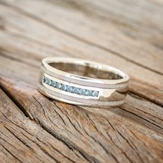 a close up of a ring on a wooden surface