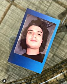 a close up of a person's face on a glass table