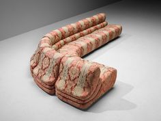 three couches sitting on top of each other in an empty room with no one around them