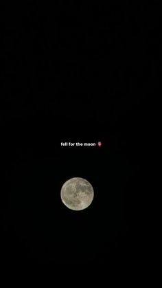 the full moon is seen in the dark sky with words written on it and an image of