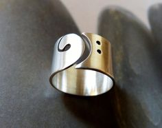 Bass clef ring, silver wide band, gift for music lover, musicians ring, gift for musicians, blass clef jewelry, bass guitar, music jewellery Unique metalwork ring from Sterling silver. This ring is my own design. I sawed a bass clef symbol into a Sterling silver sheet. Sanded and polished to satin finish. Hallmarked. Perfect as graduation gift for musicians. Ring size: please select your size. Width: 12 mm Each ring is individually handmade by me, you will receive a very similar ring, but... Sterling Silver Jewelry For Concerts, Modern Band Jewelry Gift, Silver Band Jewelry For Concert, Silver Band Jewelry For Concerts, Music-themed Band Jewelry As Gift, Music-themed Band Jewelry Gift, Silver Music-themed Rings For Gifts, Music-themed Silver Ring As A Gift, Music-themed Silver Rings For Gifts