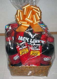 a gift basket filled with jack's red hot sauces and ketchup