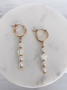 14k gold filled hoops adorned with mini rice & star pearls, and gold filled beads. Length is about 2 inches and hoop is about 15mm. Shown with Chunky Oval Hoops and CZ Stud Earrings. White 14k Gold Filled Hoop Earrings, Star Pearl, Snake Charmer, Ideas Jewelry, Jewerly Making, Gold Filled Hoops, Cz Stud Earrings, Big Fish, Jewelry Inspo