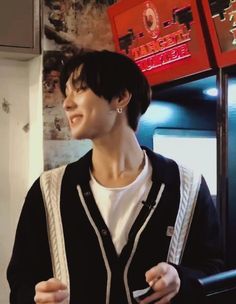 a man standing in front of a vending machine