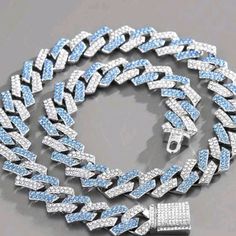 Ice Blue Stainless Steel Zirconia Necklace Silver Cuban Link Necklace With Rhinestones, Silver Rhinestone Cuban Link Necklace, Elegant Blue Jewelry With Silver Chain, Sterling Silver Blue Chain Jewelry, Silver Crystal Cuban Link Necklace, Sterling Silver Chain Jewelry In Blue, Blue Diamond Jewelry For Party, Blue Crystal Jewelry With Rhinestones, Silver Crystal Iced Out Necklace