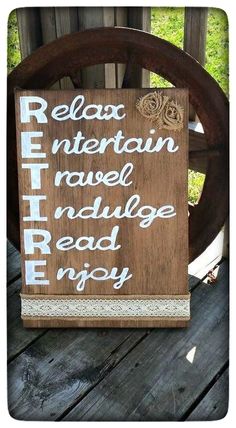 a wooden sign that says relax, entertain, ravel and village read enjoy