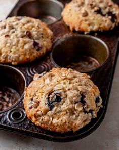 muffins with oatmeal and raisins sitting in a muffin tin