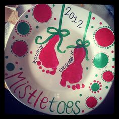 a white plate with red and green designs on it that says mitts totes