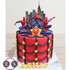 a spiderman themed birthday cake with the name ash on it and stars in the middle