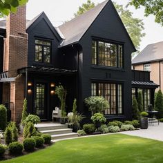 7 Bold Exterior Brick Paint Color Ideas for Your Home • 333 Images • [ArtFacade] Exterior Brick Paint Colors, Black Brick House, Black Exteriors, Black Home Exterior, Brick Paint Colors, Modern Tudor, Black Houses, Bg Design