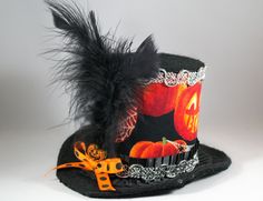 Lightweight and very easy to wear, it can easily be positioned and secured at the appropriate angle, with two alligator clips, hidden from sight. Brim made with fabric and wire so its easy to bend to adjust to head. This mini hat is 3 1/2 inches tall. Perfect hat to complete your Halloween look! This hat is ready to ship only in the U.S. because of the feathers. Please contact me with any questions you might have. Follow me on Facebook and Instagram. https://www.facebook.com/EleyasDesigns/ https Themed Mini Hat With Adjustable Short Brim, Themed Adjustable Mini Hat With Short Brim, Halloween Adjustable Top Hat With Short Brim, Halloween Top Hat With Short Brim, Adjustable Short Brim Top Hat For Costume, Halloween Adjustable Top Hat With Curved Brim, Adjustable Curved Brim Top Hat For Halloween, Themed Adjustable Top Hat With Curved Brim, Adjustable Mini Hats With Short Brim For Halloween