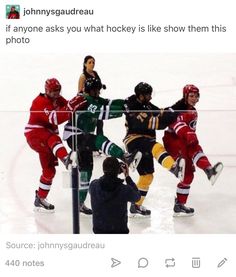 a group of people standing on top of a ice rink next to each other in hockey uniforms