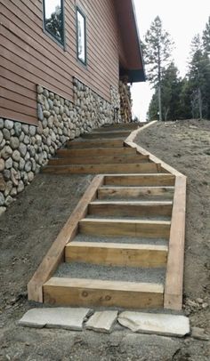 the steps are made from wood and have been built into the side of the house