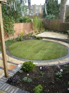 a circular lawn area in the middle of a yard