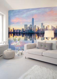 a living room with a large cityscape on the wall and white furnishing