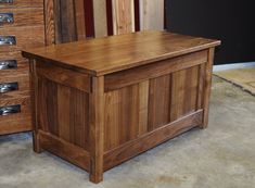 a wooden chest sitting on top of a floor