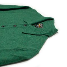 "A favorite style of ours made up in some of the easiest colors to wear in the Fall. Wear it over a tee or even layer atop other shirts, it's a super versatile piece of clothing that's worthy of the high praise it gets."---Ludwin Details 100% wool Knit polo with ribbed placket, cuff and hem; branded button closure Made in China Size & Fit Regular fit; we recommend taking your true size for best fit Aran Cardigan, Umbrella Shop, Classic American Style, Fall Wear, Knit Polo, Uniform Fashion, Green Wool, Wool Knit, Trouser Suits