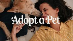 a woman laying in bed next to a dog with the words adopt a pet on it