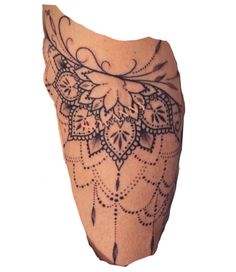 an ornate tattoo design on the leg