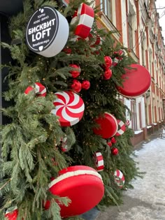 christmas decorations on the side of a building