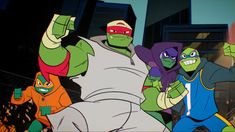 the teenage mutant ninjas are dancing in front of an apartment building with their arms up