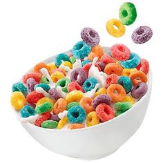 a white bowl filled with cereal sitting on top of a table