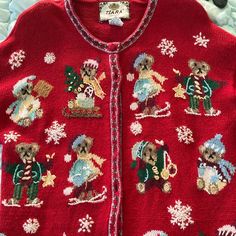 a red sweater with bears and snowflakes on it