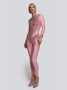 Composition: Spandex Washing instructions: Hand Wash Designer Style ID: GC95-571249 Model is wearing size XXS Dare to go bold in our beaded Riley Jumpsuit. This jumpsuit features meticulously placed crystals that create an illusion of cascading jewelry across the body. The high neckline and long sleeves contrast the open back. This showstopper is perfectly tailored to contour and celebrate the figure. Shown here in Pink. Beaded Jumpsuit, Pink Jumpsuit, Evening Jackets, Sandals For Sale, Designer Style, Trendy Tops, High Neckline, Outerwear Women, Dress Accessories