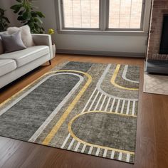 a living room with a large rug on the floor next to a couch and fireplace