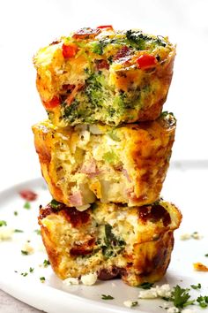 three breakfast muffins stacked on top of each other