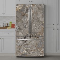 a marble refrigerator freezer sitting in a kitchen