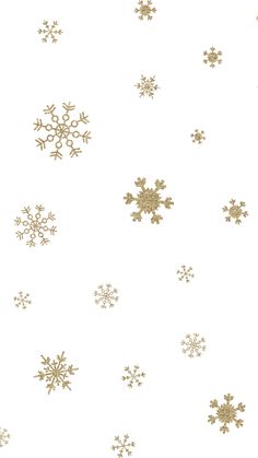 gold snowflakes are on a white background