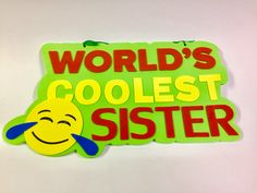 a sign that says world's coolest sister with a smiley face on it