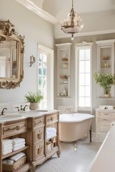 a bath room with a tub a sink and a mirror on the wall in it