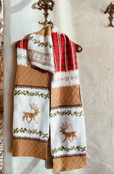 Hand-knit winter scarf with deer «Ralph». With two noble reindeer, traditional cage, plant patterns and folk Scottish motifs. Wool deer pattern christmas scarf suits both men and women. Nordic knitted scarf  is tied from 100% high quality yarn. Hand embroidery. Length 2.58 m Width 21 cm Doesn't shoot, doesn't stretch. The scarf will be a chic accessory in both women's and men's wardrobe, as it suits both men and women. Traditional White Winter Scarves, Traditional White Scarves For Winter, Antique Hanger, Woolen Scarf, Brown Scarf, Woolen Scarves, Christmas Scarf, Brown Scarves, Deer Pattern