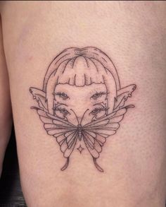 a woman's thigh with a butterfly tattoo on it