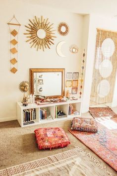 a living room filled with lots of furniture and decor on top of carpeted flooring