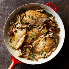 chicken with mushrooms and onions in a skillet on a table top, ready to be eaten