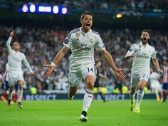 the soccer player is celebrating his goal in front of an audience at a sporting event