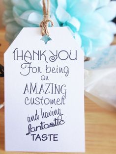 a thank you tag hanging from a table