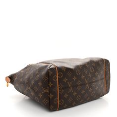 This is an authentic LOUIS VUITTON Monogram Totally MM. This tote is crafted of classic Louis Vuitton monogram-coated canvas. The bag features bucket pockets on either side, and vachetta cowhide leather trim and shoulder straps, with brass hardware. The top zipper opens the bag to a cocoa brown fabric interior with patch pockets. Cocoa Brown, Brown Fabric, Brass Hardware, Authentic Louis Vuitton, Leather Trim, Cowhide Leather, Leather Trims, Louis Vuitton Monogram, Patch Pocket